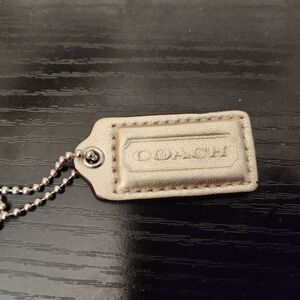 Coach Gold hang tag..